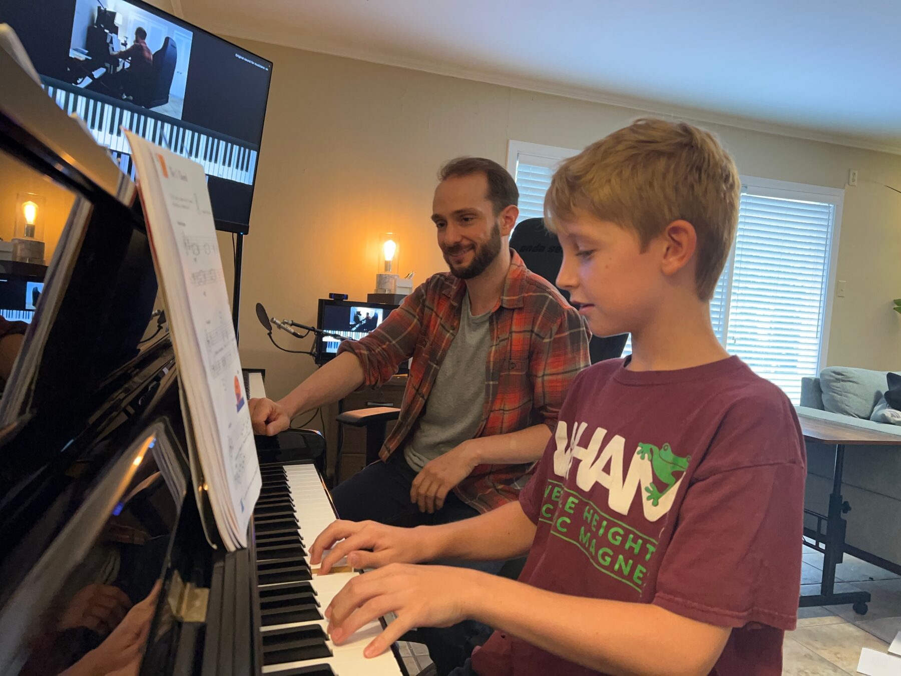 Jon teaching a young student at the piano